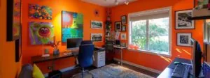 a sleek, modern home office with vibrant, energizing paint colors to boost productivity and style